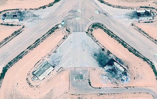 The Ghardabiya airbase's hardened shelters destroyed during the B-2A air strike. Internal explosions blew the shelters doors tens of meters away. Photo: Maxar