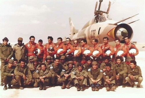 The pilots and technical crew of the Libyan 1022nd Squadron in front of their Su-22M (S-52K) 'Fitter' reconnaissance bomber at Ghardabiya airbase in 1986. The Su-22M aircraft with tactical number black 338 still bears its factory sand-brown and green camouflage paint, which has faded slightly under the North African sun. The pilots and technical crew of the Libyan 1022nd Squadron in front of their Su-22M (S-52K) 'Fitter' reconnaissance bomber at Ghardabiya airbase in 1986. The Su-22M aircraft with tactical number black 338 still bears its factory sand-brown and green camouflage paint, which has faded slightly under the North African sun.