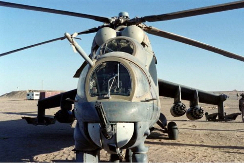 A captured Libyan Mi-25 (Mi-24D)  Hind-D  attack helicopter (B/N: 302) from the 1325th Squadron, at Ouadi Doum airport in North-Chad on April 8, 1987. Photo: Doninique Faget/AFP