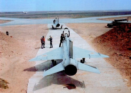 The 116th Air Defence Training Centers two Soviet MiG-21F-13 Fishbed-C aircraft and a Su-11 Fishpot-C interceptors in the background.