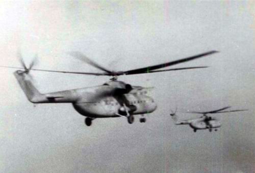 Soviet 688th Independent Helicopter Regiments Mi-6 Hook heavy cargo helicopters in the sky. Each squadron used an average of 10 large transport helicopter.