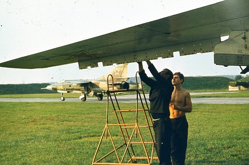 Soviet Tactical Air Force's 7th Bomber Air Regiment, Starokonstaninov ground crew front of his Su-24M Fencer-D. Behind 168th Fighter Air Regiment's MiG-23ML Flogger-G