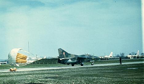 The 179th Fighter Bomber Air Regiments MiG-23UB Flogger-C type is rolling in front of the 260th Long Bomber Regiment's bomber Tu-16s at Striy airport.